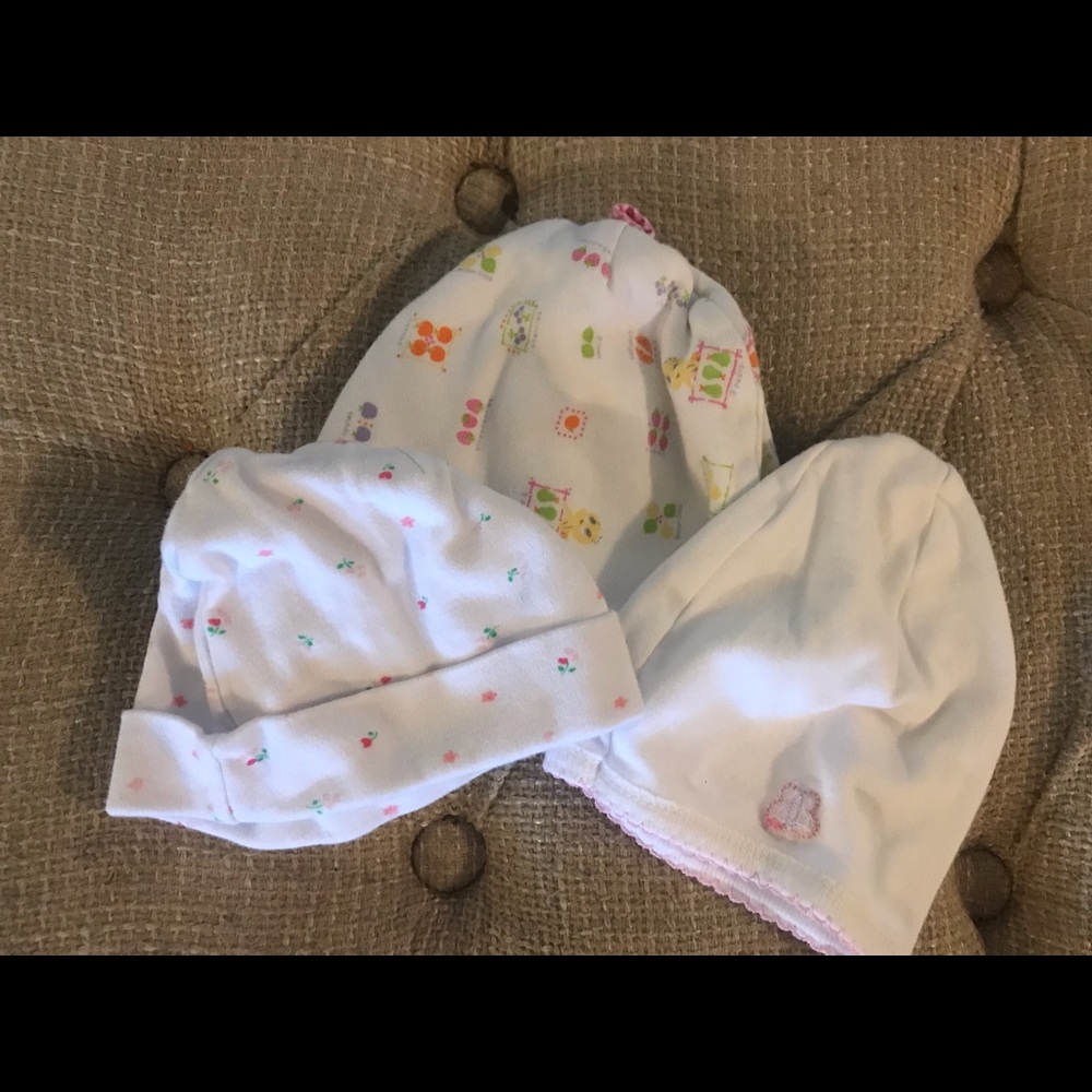 Three small baby hats